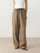 100% linen wide-leg pants with high-rise elastic waist and side pockets
