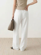 High-rise wide-leg 100% linen pants with elastic waistband and side pockets