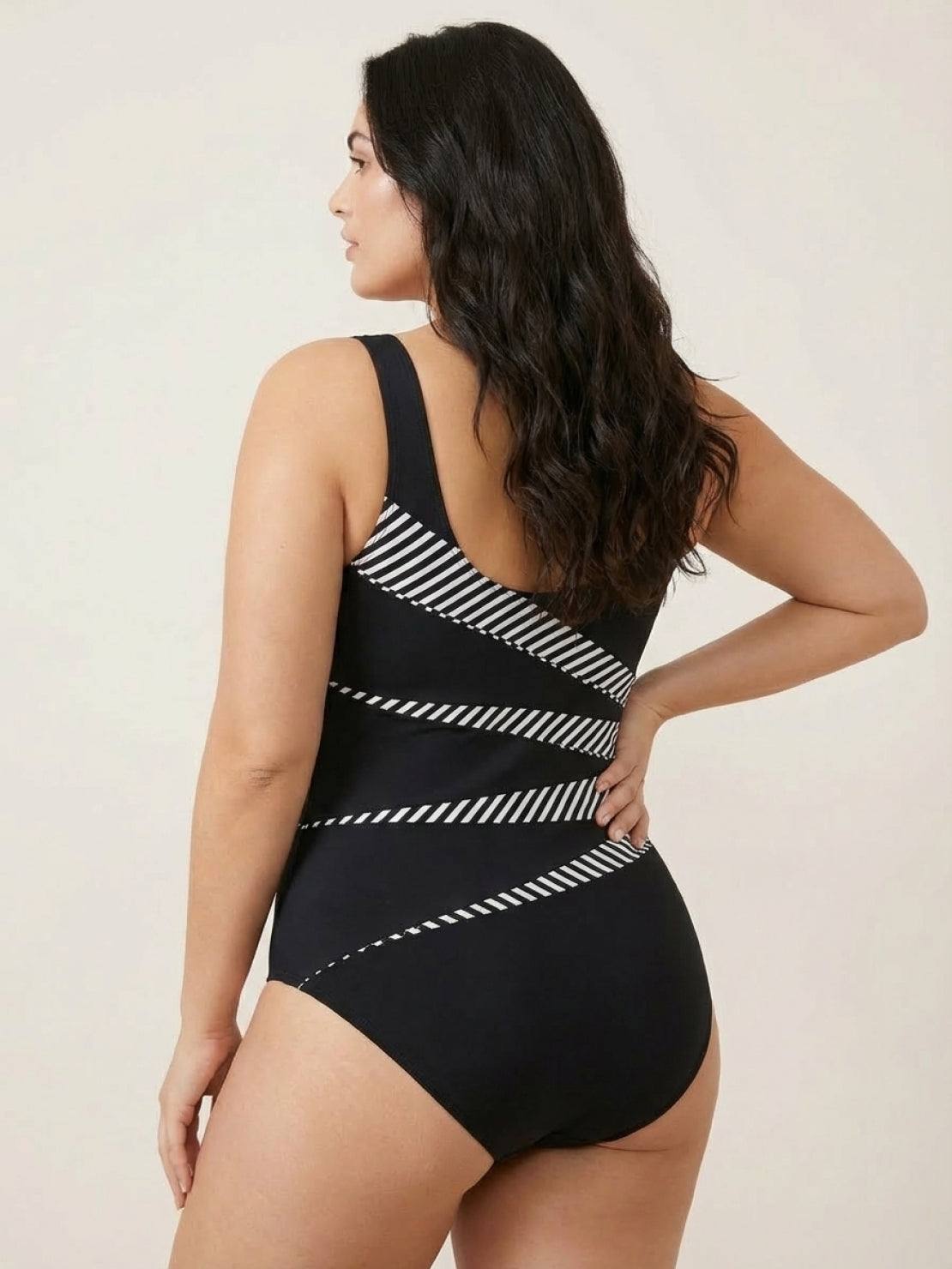Curve-Fit Open-Back Swimsuit with scoop front, deep V back, diagonal panels, and adjustable straps in black polyester fabric.