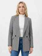 Black and white houndstooth commuter blazer with structured shoulders and relaxed fit