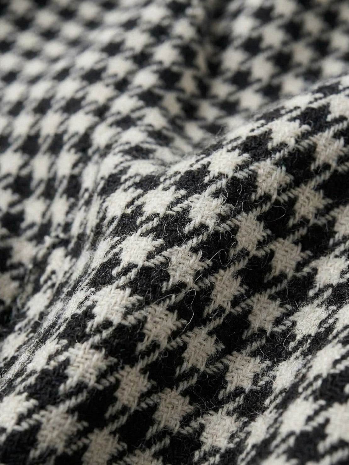 Black and white classic houndstooth commuter blazer with relaxed fit and structured shoulders