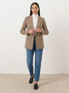 Structured houndstooth commuter blazer with relaxed fit, notched lapel, double-button closure, and front pockets
