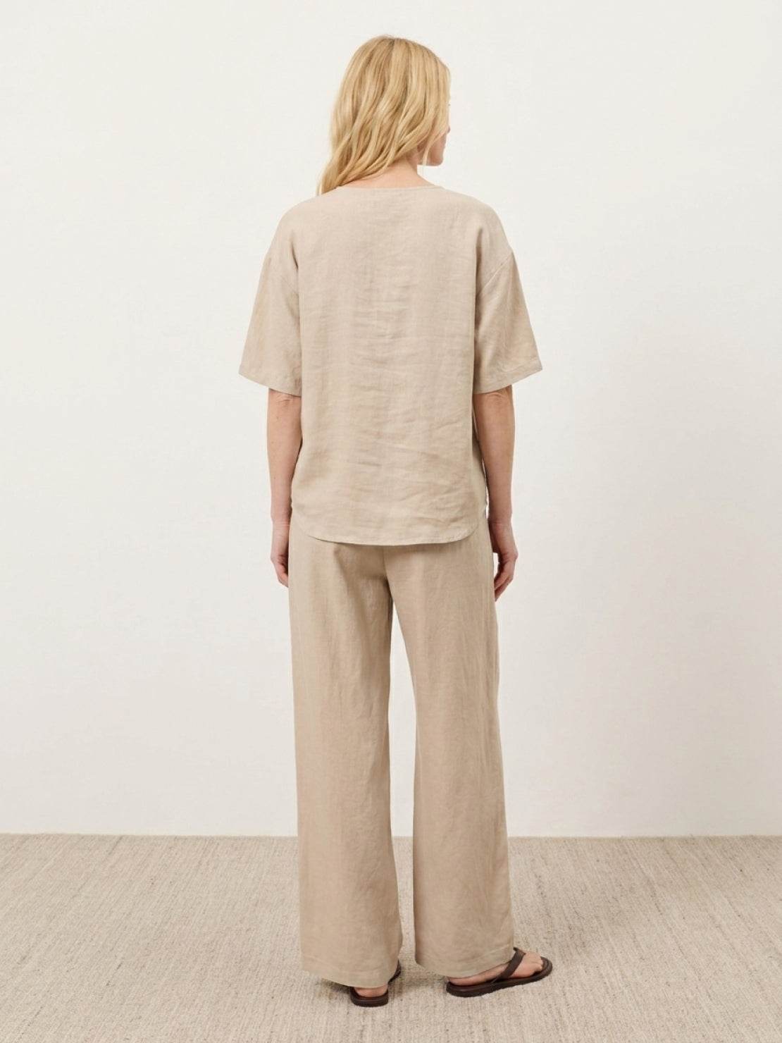 Women wearing 100% cotton relaxed fit two-piece set with button-front top and wide-leg pants in soft solid color