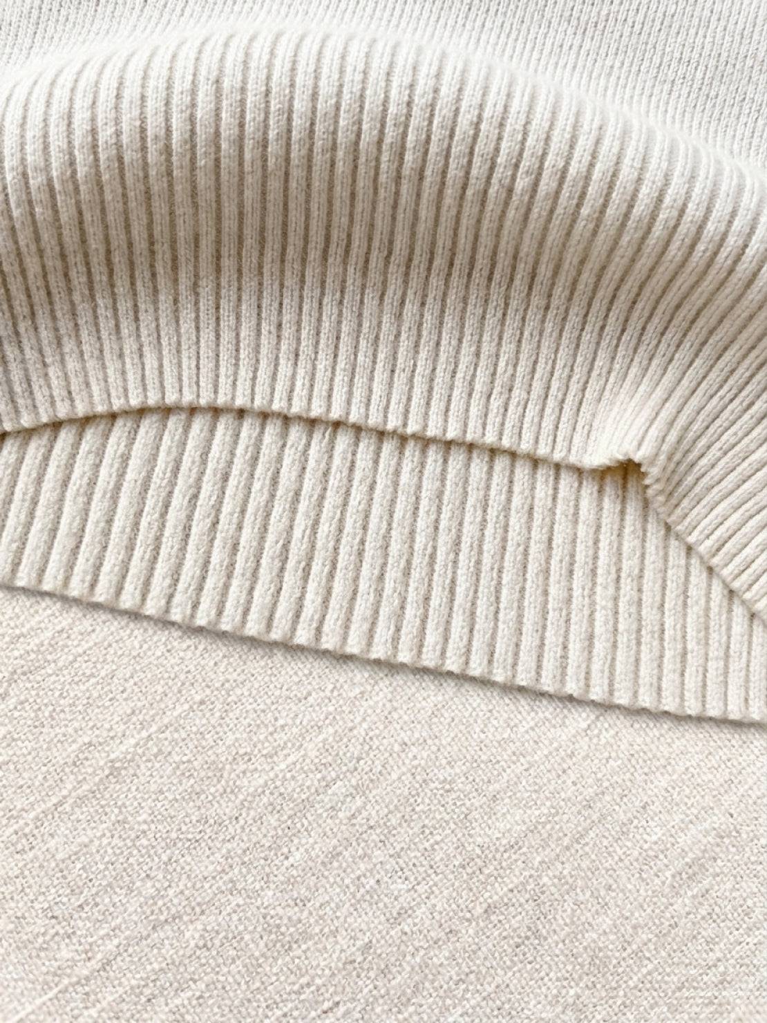 knit vest with attached scarf in soft fine ribbed knit and sleeveless design