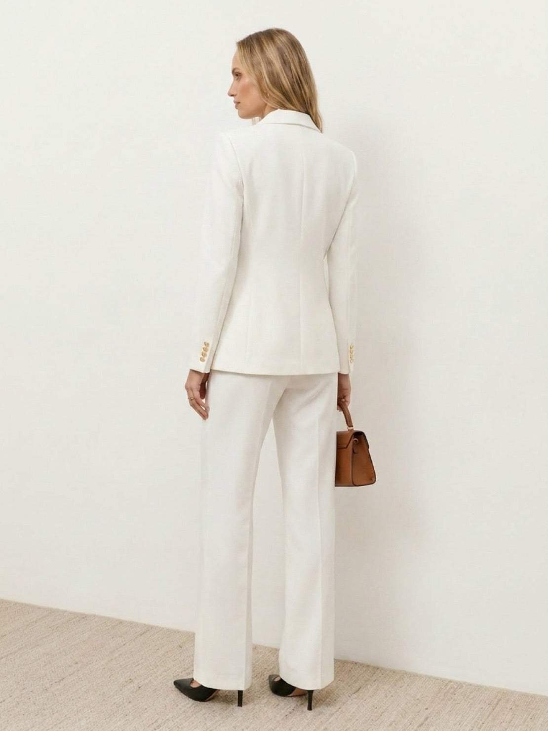 Double-breasted blazer and wide-leg trousers co-ord set with gold lion-head buttons and notched lapel.