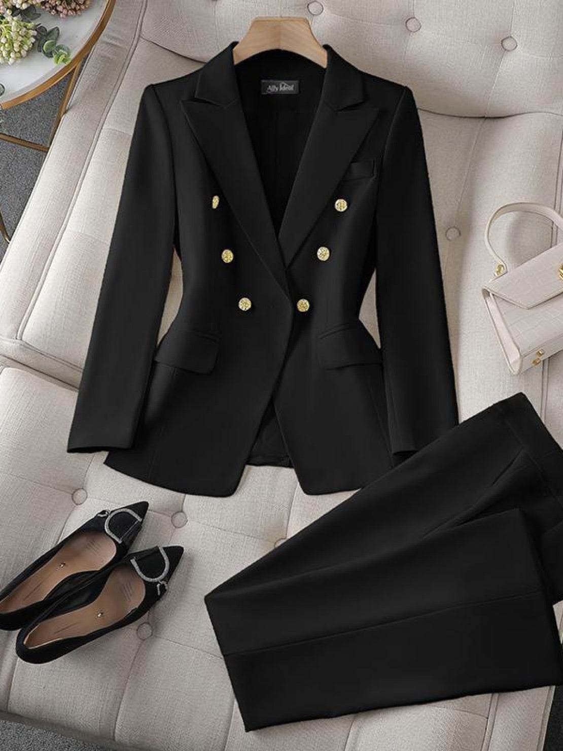 Double-breasted blazer with gold lion-head buttons and wide-leg trousers co-ord set in structured suiting fabric