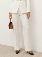 Double-breasted blazer with gold lion-head buttons and wide-leg trousers co-ord set