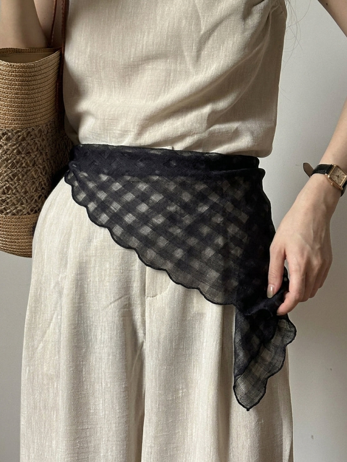 Lightweight 100% linen neck scarf with timeless checkered pattern and natural rolled edges