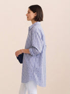 Oversized linen shirt in relaxed fit with back pleat and button-up design
