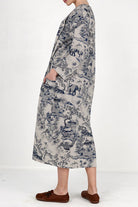 Woman wearing Japanese porcelain print midi dress with blue pattern and oversized pockets