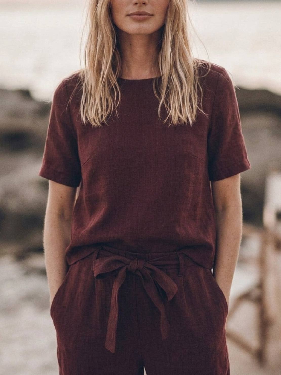 Woman wearing relaxed cotton linen set with short-sleeve top and straight-leg pants in monochrome tones