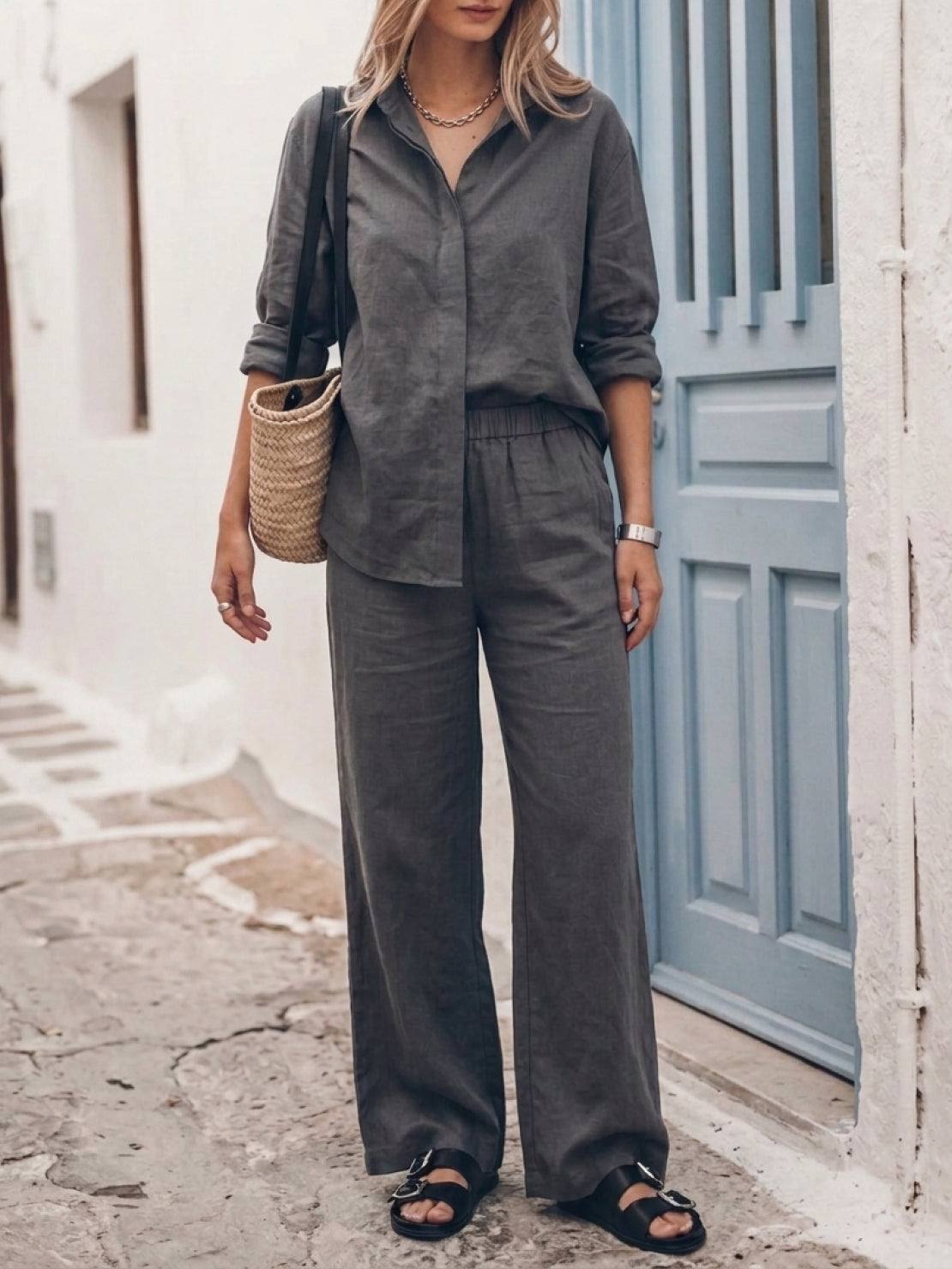 Woman wearing oversized 100% cotton shirt and wide-leg pants co-ord set in neutral color