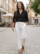Two women modeling casual chic duo breathable cotton and linen two-piece sets in monochrome tones