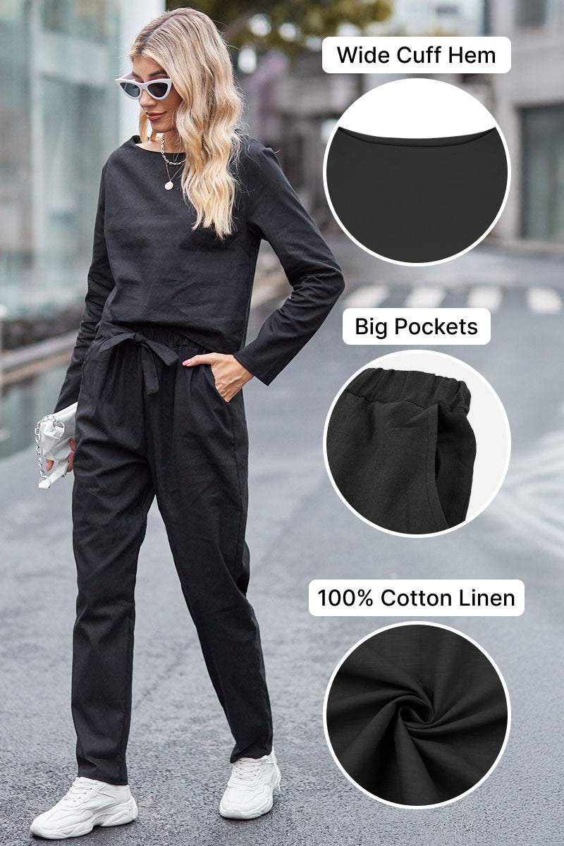 Woman wearing black cotton-linen monochrome relaxed longline top and fluid wide-leg pants with wide cuff hem and big pockets