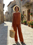 Loose solid color sleeveless two-piece set with oversized fit and breathable cotton blend fabric