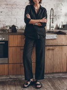 Model wearing an oversized 100% cotton shirt and wide-leg pants co-ord set in a relaxed fit and breathable fabric