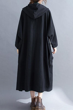 Back view of one size fits all oversized black windbreaker jacket with waterproof design and attached hood