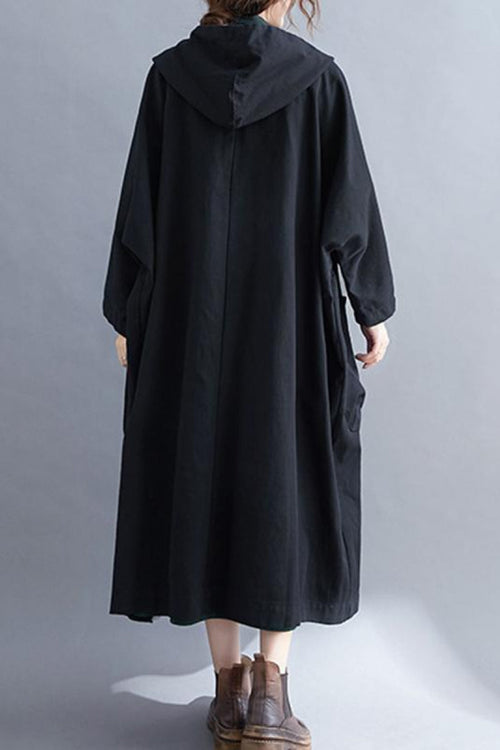 Back view of one size fits all oversized black windbreaker jacket with waterproof design and attached hood