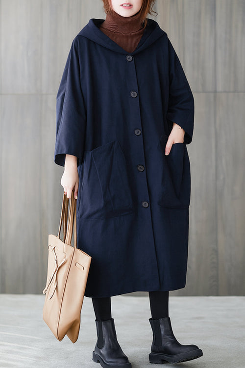 Oversized waterproof windbreaker jacket with hood and large pockets in navy blue