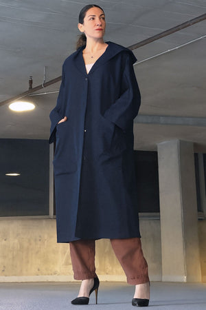 One size fits all oversized water resistant windbreaker jacket with waterproof design and attached hood.