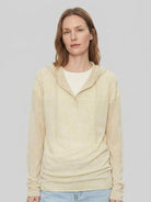 Organic linen henley top with fine knit, relaxed fit, and side slits in neutral heathered fabric