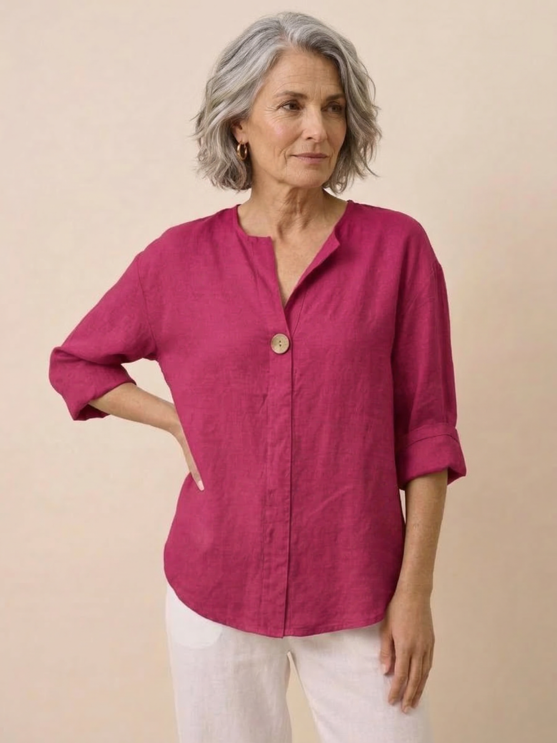 White pure linen age-defying shirt with button detail on hanger