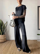 Silken Escape Satin Two-Piece Set with flowing satin fabric, wide-leg pants, and slimming top for elegant comfort