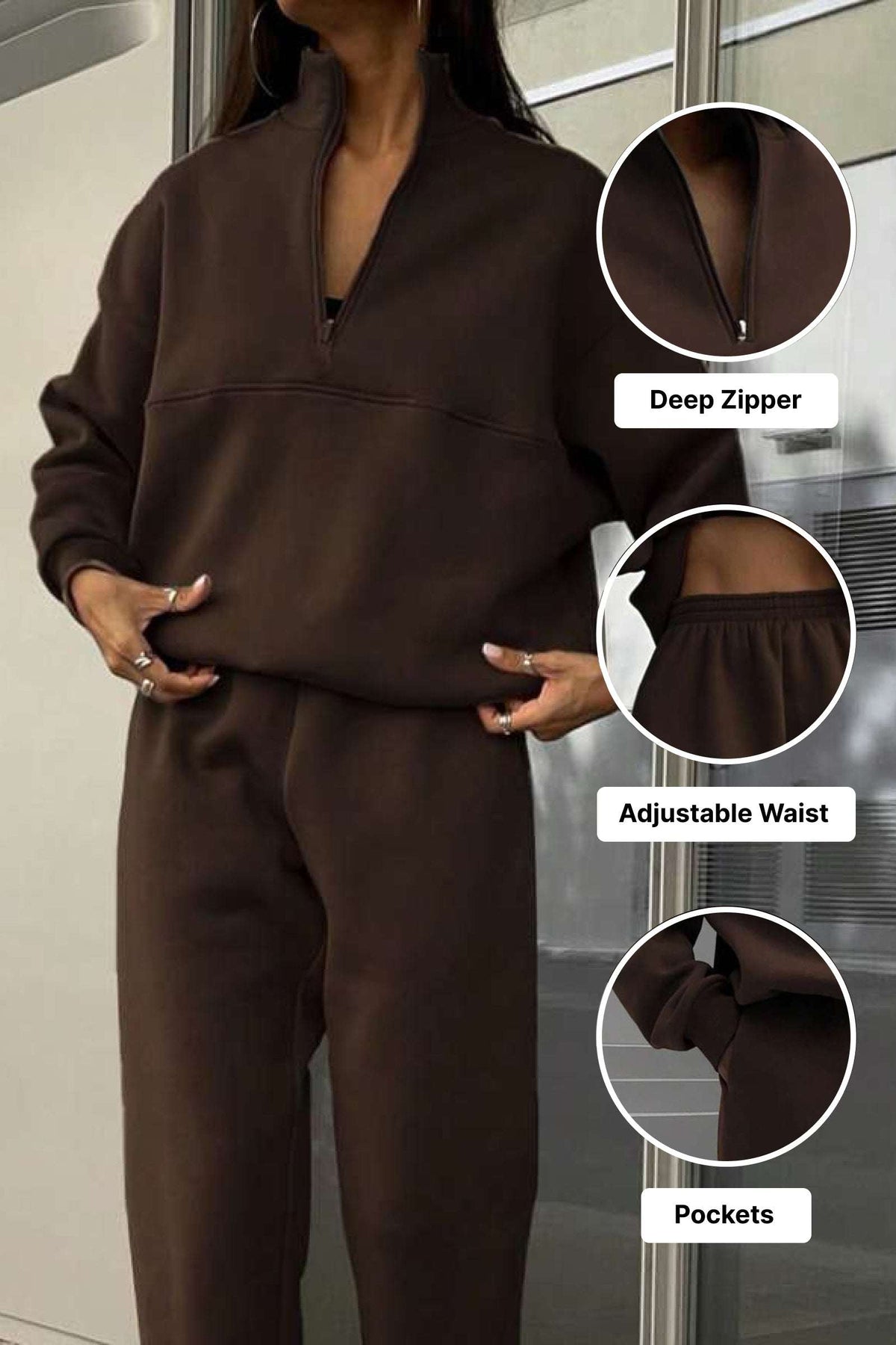 Brown cotton blend tracksuit with deep zipper, adjustable waist, and pockets for tailored comfort and style.