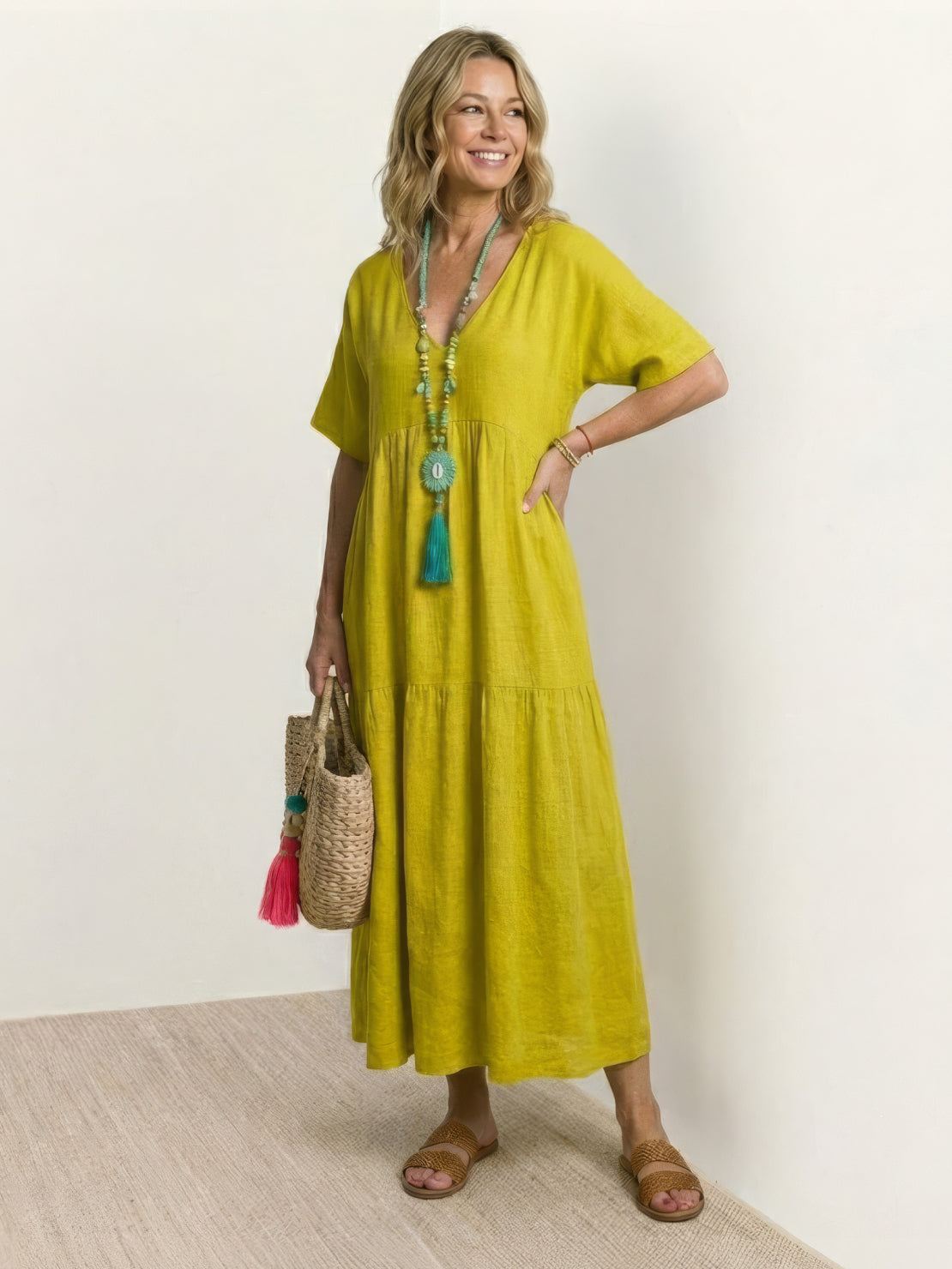 V-neck two-tiered maxi swing dress in flowing tiers with irregular hemline and draped sleeves in 100% cotton