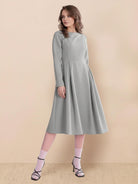 Water-repellent A-line hooded raincoat for women with insulated lining and matching belt