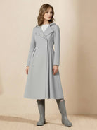 Water-repellent A-line hooded raincoat with belt, insulated lining, and feminine fit for women