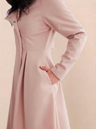 Elegant A-line water-repellent raincoat with hood and belt for women