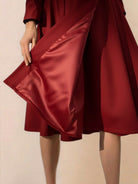 Water-repellent A-line hooded raincoat for women with belt and insulated lining