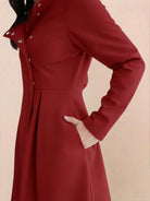 Elegant water-repellent hooded A-line raincoat for women with insulated lining and belt