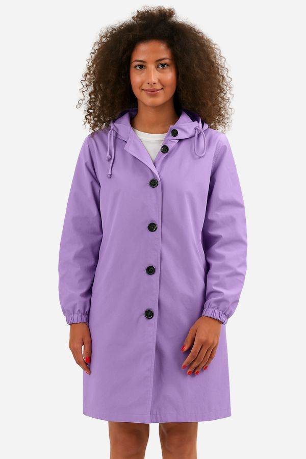 Woman wearing purple oversized Rain Couture Windbreaker jacket with buttons and hood